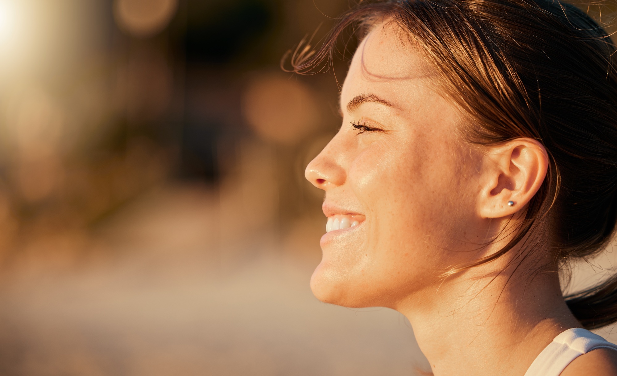 Happy, calm and face of a woman at the beach to relax, breathe and free the mind in Thailand. Freed